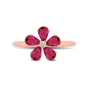 Anillo de oro rosa, rubíes y un diamante central