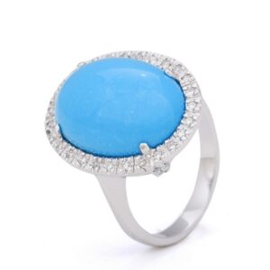 Anillo de oro blanco con turquesa central y diamantes
